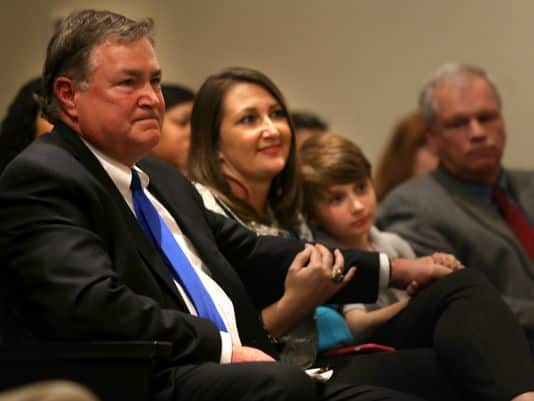 Judge Tim Dwyer, seated with wife Belynda and son Conor, 9, is moved by the speeches given by drug court graduates during an event celebrating 20 years of service by Shelby County Drug Court held in the auditorium of the Criminal Justice Center. (Photo: Nikki Boertman/The Commercial Appeal)