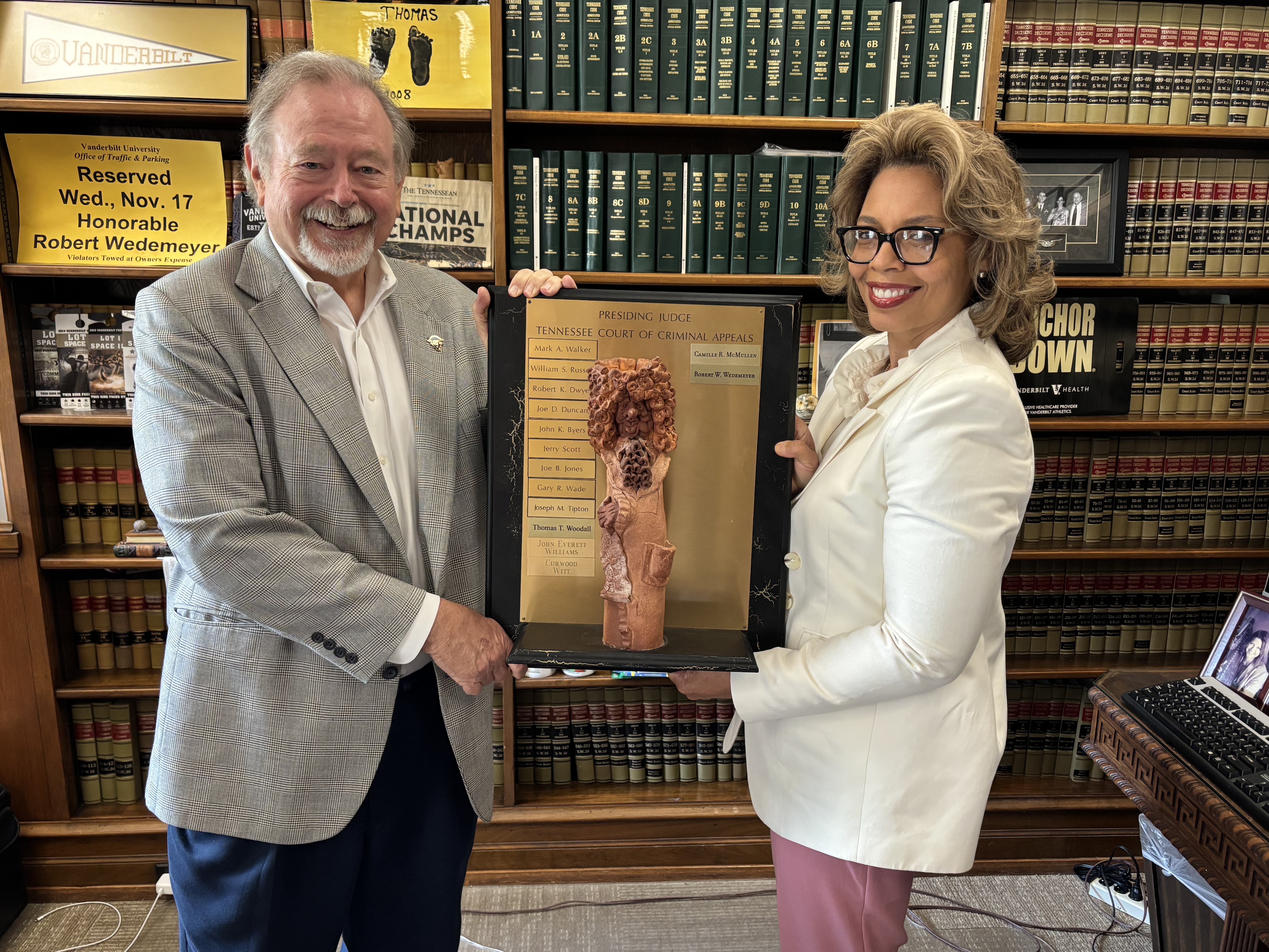 Outgoing CCA Presiding Judge Camille McMullen Passes the Infinity/Eternity Plaque to Newly Elected CCA Presiding Judge Robert Wedemeyer