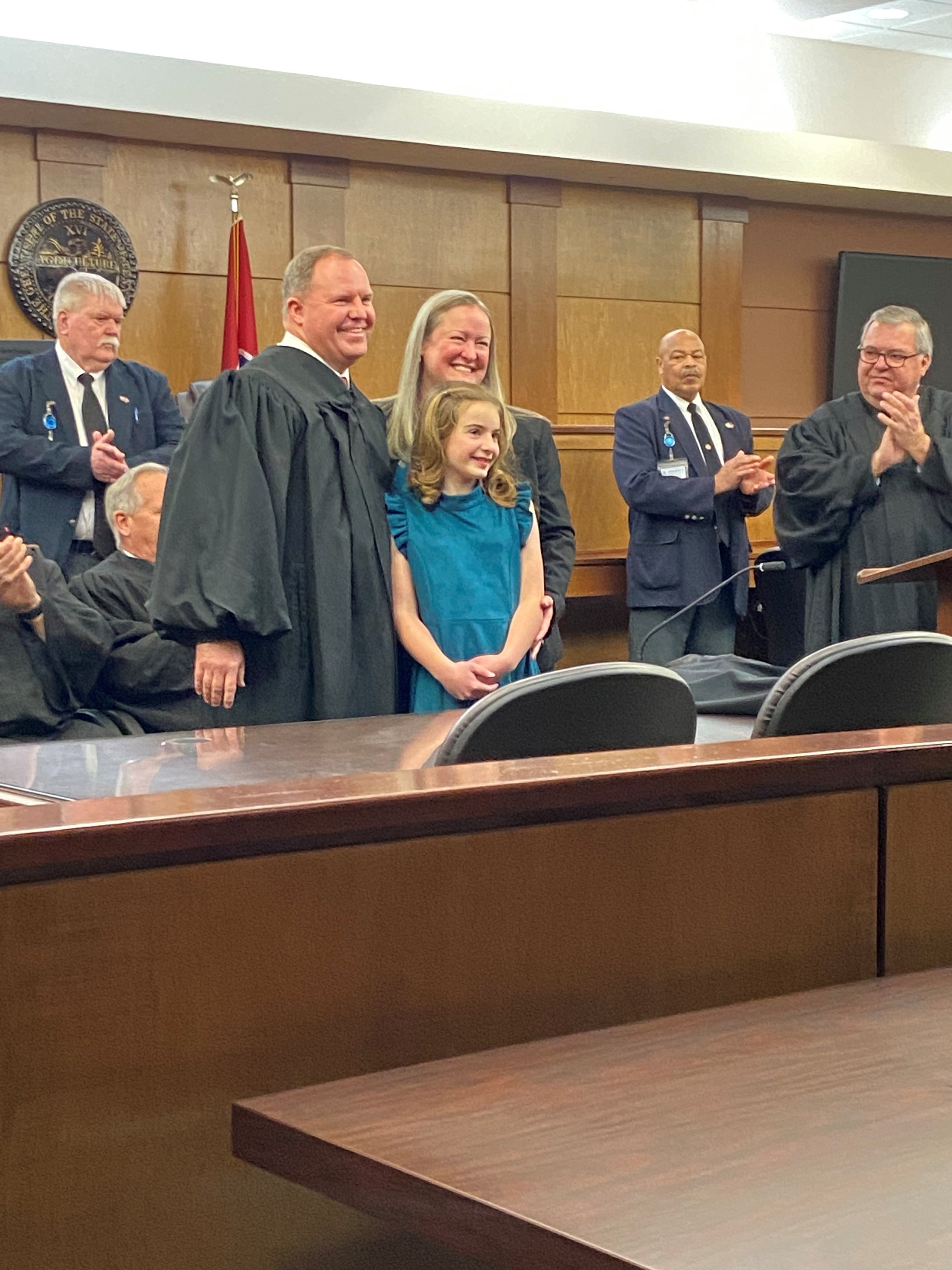 Judge Ball celebrates with his wife, Shelley, and daughter, Dana.