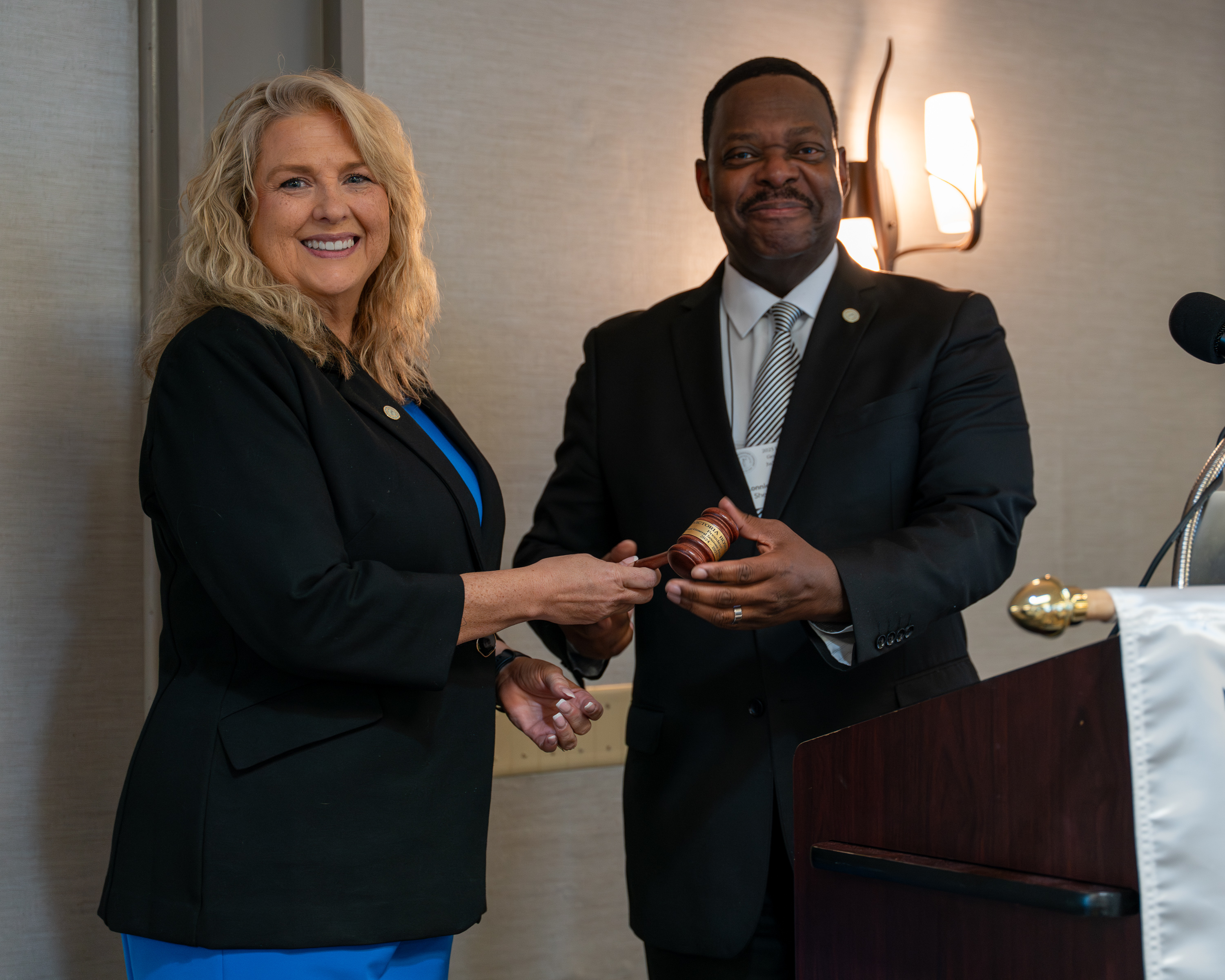 Outgoing General Sessions Judges Conference President Victoria Bowling passes the gavel to newly elected President, Judge Lonnie Thompson