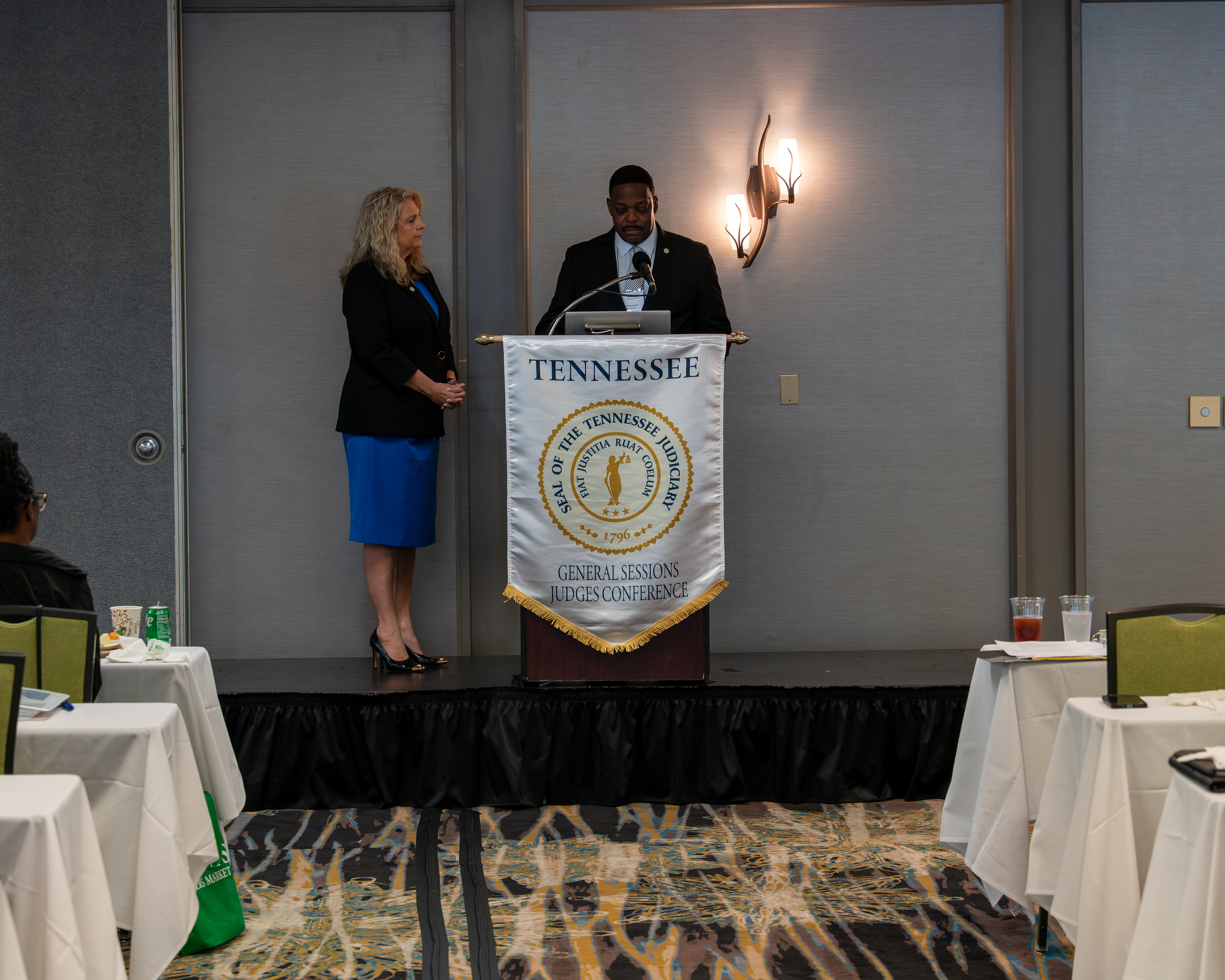 Judge Thompson speaking at the conference with Judge Bowling looking on