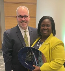 Richard Kennedy, Executive Director, Tennessee Commission on Children and Youth presents the award to Judge Sheila Calloway